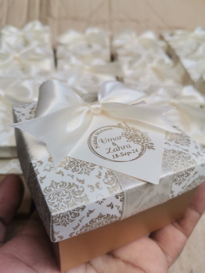 White And Golden Box With Bow